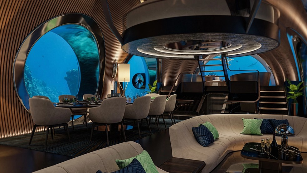 A sala de estar e de refeições do iate tem amplas janelas redondas de 4 m de diâmetro — Foto: U-Boat Worx / Reprodução